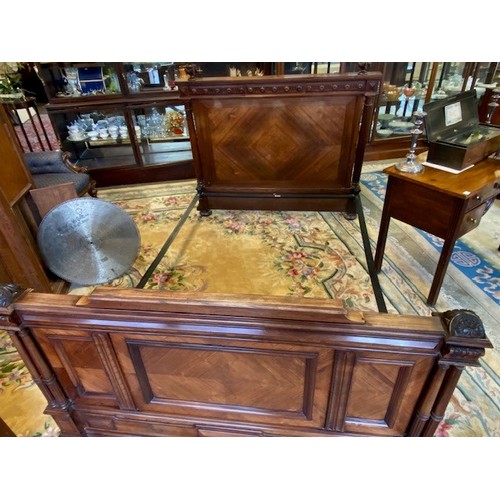 56 - A French rosewood 4ft. 6in. bedstead with urn and swag finials, twin pillars to the headboard