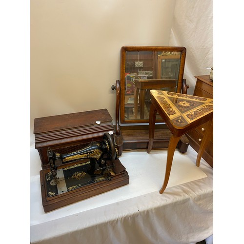 45 - A Victorian mahogany framed swing toilet mirror, the base with hinged lid, a Singer hand sewing mach... 