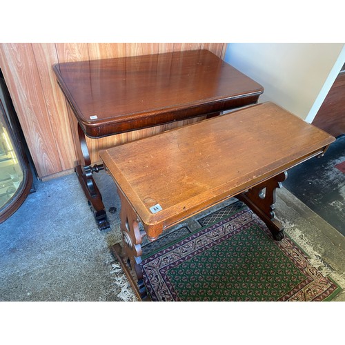 84 - A Victorian mahogany table with rectangular top, on shaped end standards terminating in scroll feet ... 