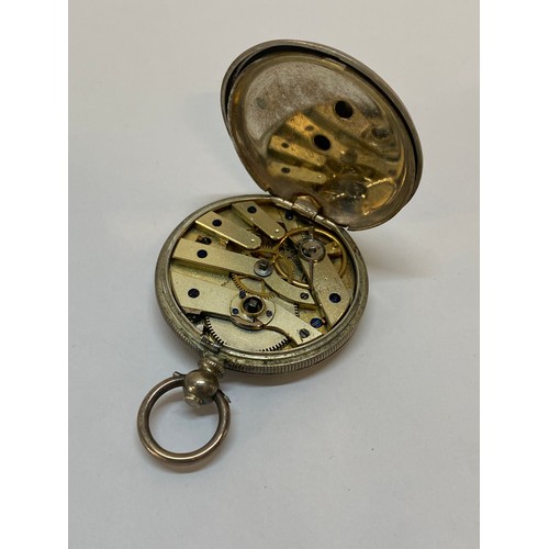 296 - A lady's openface fob watch with white enamel dial, in a fine silver case with engraved decoration