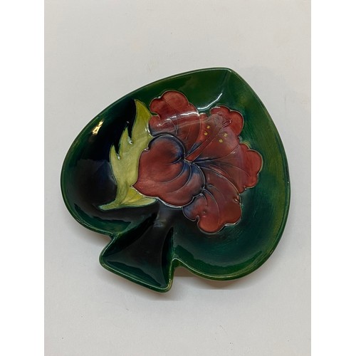 225 - A Moorcroft dish, green ground decorated hibiscus - 5 1/4in. wide