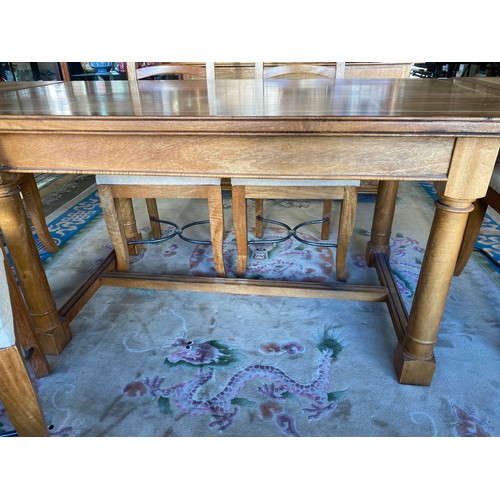 142 - A modern Baker fruitwood and flagstone inlaid drawleaf dining table on turned legs joined by an 'H' ... 