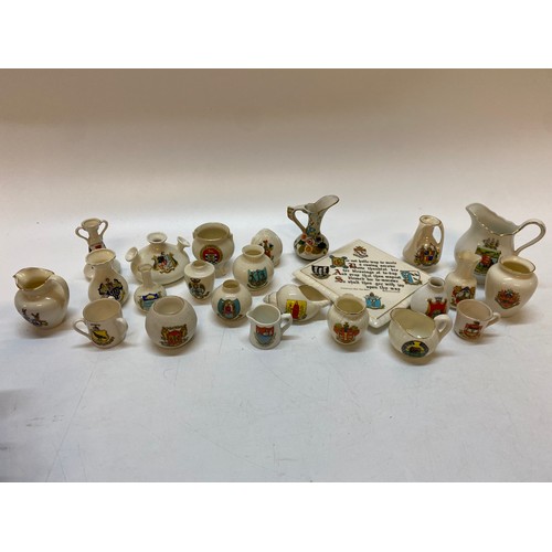 208 - A W.H Goss teapot stand and a selection of commemorative china