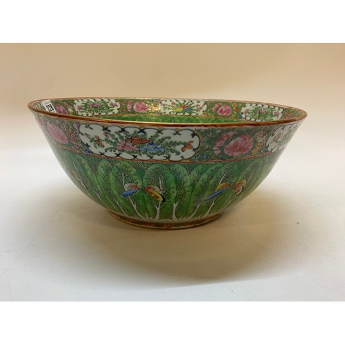 228 - A large Cantonese bowl with all over painted decoration of green leaves, moths, mon to the centre an... 