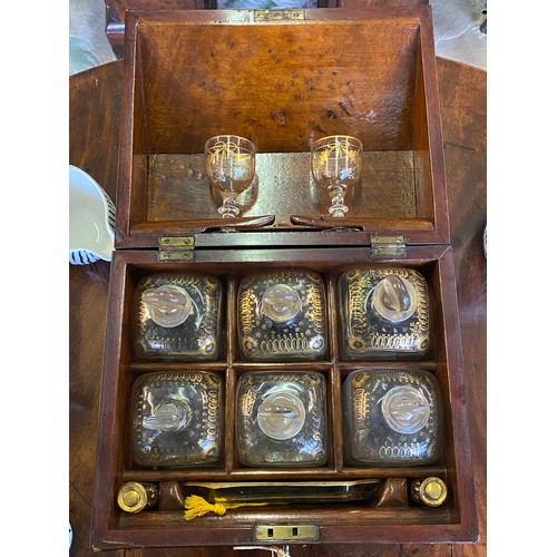 325 - A 19th Century Continental mahogany decanter box in the form of a bureau with hinged piano lid and t... 