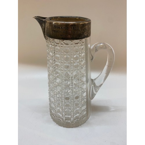 204 - A hobnail cut water jug with silver mounts