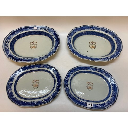 148 - A  Chinese export part dinner service with armorial crest to the centre comprising:- two large open ... 