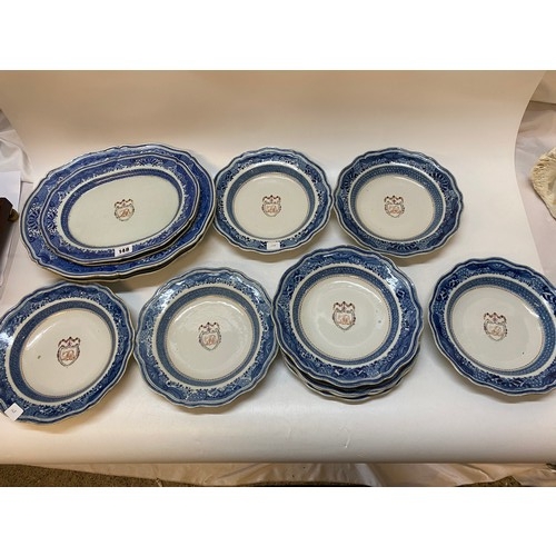 148 - A  Chinese export part dinner service with armorial crest to the centre comprising:- two large open ... 