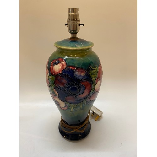 155 - A Moorcroft tablelamp base, green ground decorated anemones, green mark to the base - 12in. high