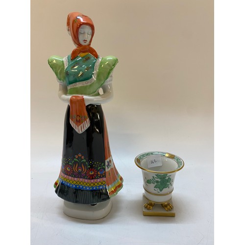 162 - A Hungarian figure of a lady in traditional dress - 11 1/2in. high and a Herend small urn painted fl... 