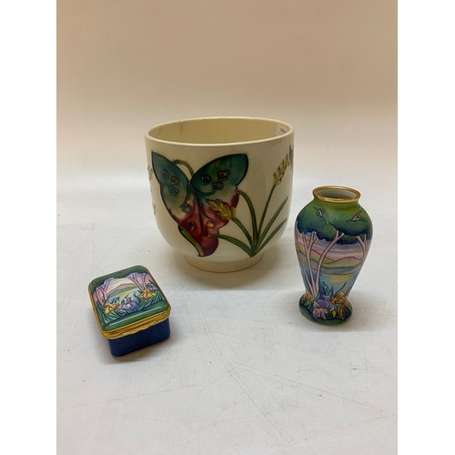 159 - A Moorcroft pot, white ground decorated Arum Lily - 4 1/2in. high, a modern Moorcroft enamel trinket... 