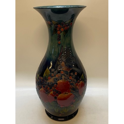 139 - A large modern Moorcroft baluster form vase, blue ground decorated finch and pomegranate pattern, de... 