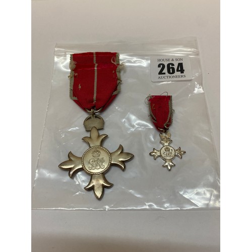 264 - A silver gilt military OBE and a matching miniature medal