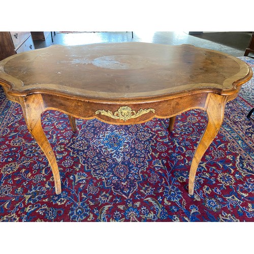 46 - A French walnut and crossbanded centre table with floral marquetry inlaid centre, serpentine border,... 