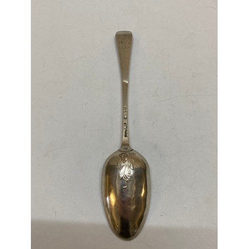 192 - A Georgian silver dessert spoon - London 1775, makers marks badly struck