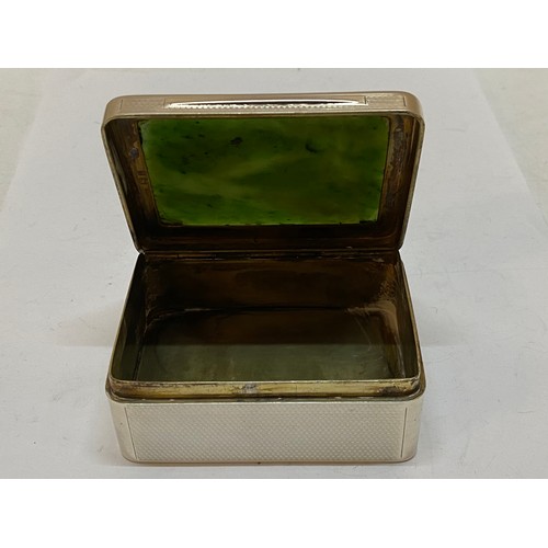 193 - A rectangular silver box with inset green jade lid, engine turned decoration - London 1920, makers m... 