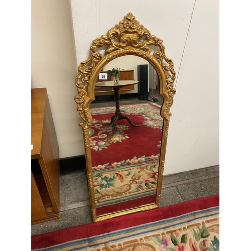 56 - A console table with shaped marble top, on carved and gilded frame - 22in. wide together with the ma... 