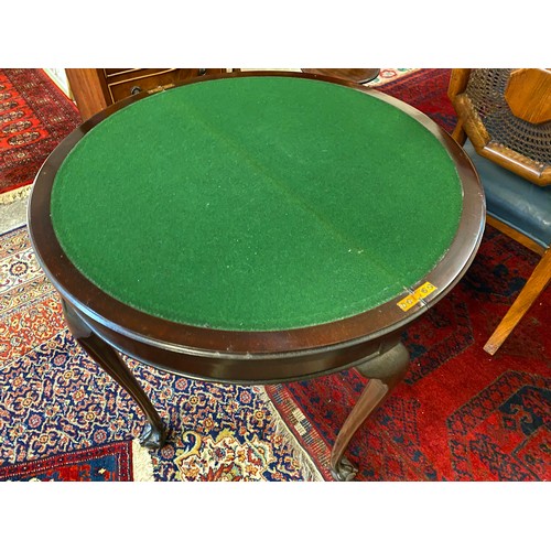 73 - A mahogany half round card table with carved edge, on slender cabriole legs with claw and ball feet ... 