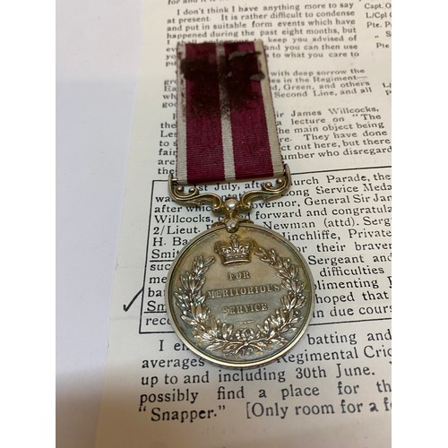 274 - A Meritorious Service medal awarded to 202566 Pte G. Smith 2/4 E. York R-TF together with a small se... 