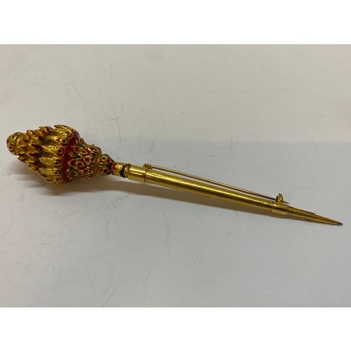 222 - An Eastern gold coloured metal and enamel jabot pin converted to a brooch