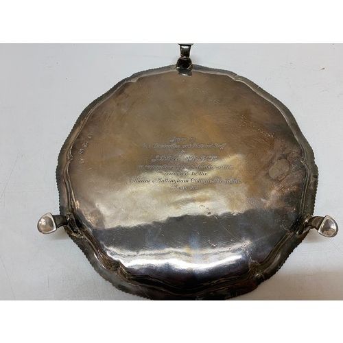 162 - A Georgian silver tray with gadroon border, raised on three pad feet inscribed to the reverse 'Given... 