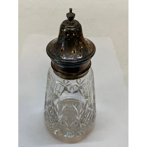 173 - A silver table bell, a cut glass sugar castor with silver top and a plain silver candlestick with ta... 