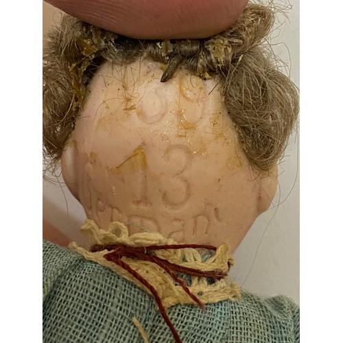 345 - A small German doll with bisque head