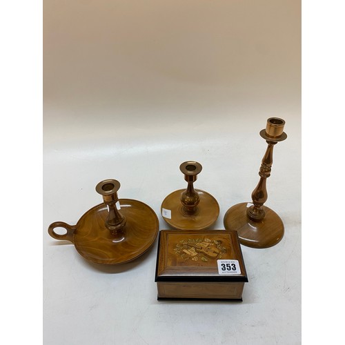 353 - A small modern yewwood musical box with musical trophies to the lid - 5in. wide and three copper can... 