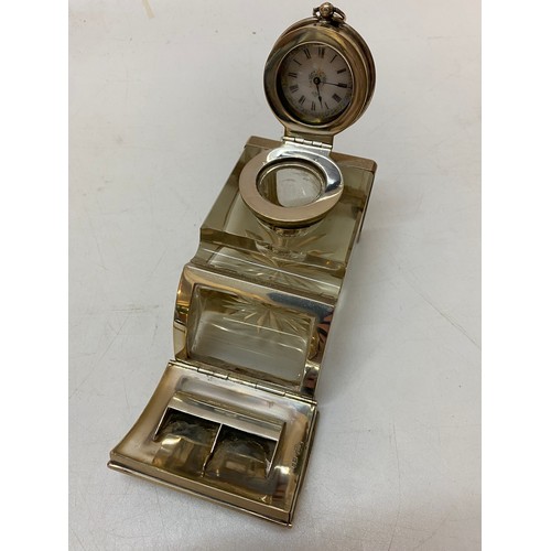 137 - A glass inkwell with silver hinged cover inset fob watch, roll front with inset photograph for stamp... 