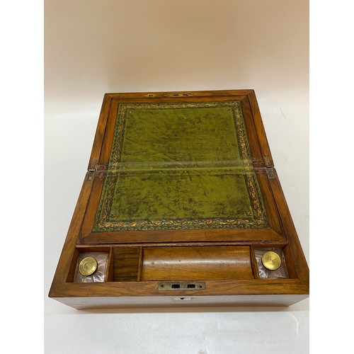 289 - A walnut and brass bounded writing box with fitted writing slope in the interior, green leather, wit... 