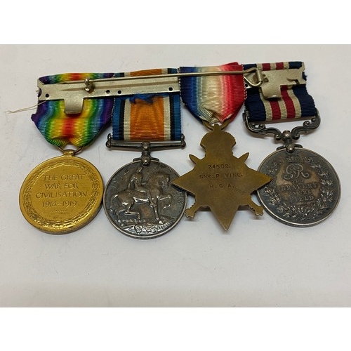 262 - A group of four First World War medals awarded to 24502 Gnr. P. Vine Y.I/T.M.By:R.G.A comprising:-19... 