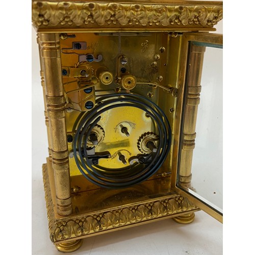 214 - A Victorian carriage clock, gilt face, circular enamel dial, alarm dial, striking movement on a gong... 