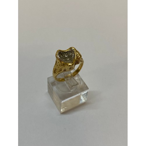 174 - A lady's ring pave set diamonds, on an 18ct. gold shank