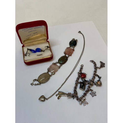 188 - A Source charm bracelet with enamel charms, boxed, a polished agate bracelet, a small silver bracele... 