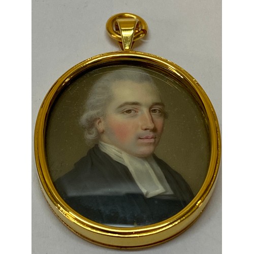 24 - Initialled J.S and dated 1773.  An 18th Century portrait miniature - Head and shoulders of a vicar, ... 