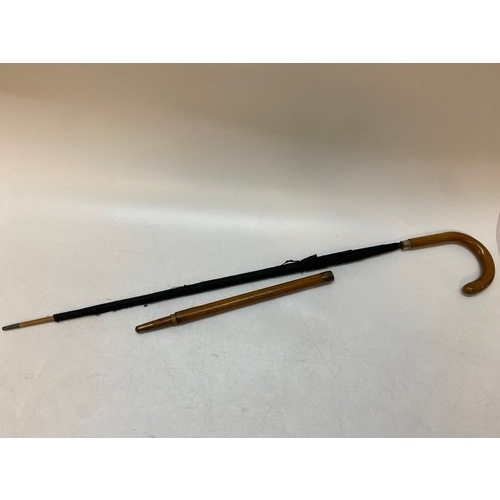 211 - A gentleman's walking stick converting to an umbrella