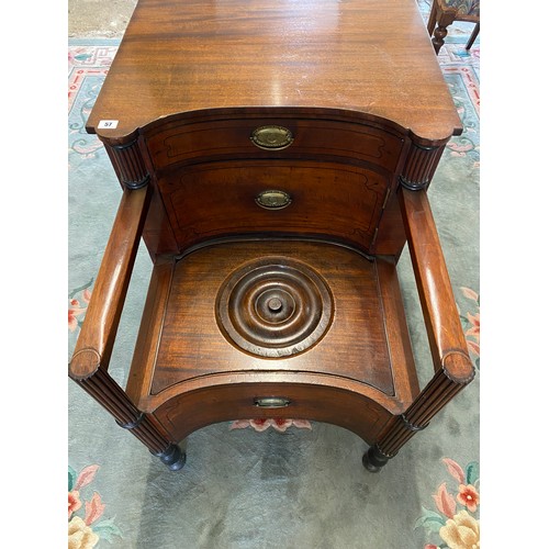 57 - An antique mahogany and ebony line inlaid commode with concave front, fitted drawer above cupboard, ... 