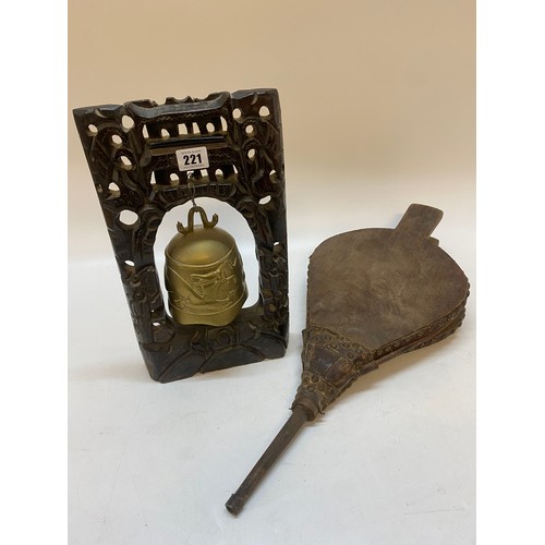 221 - A Chinese brass table gong on stand and a pair of bellows