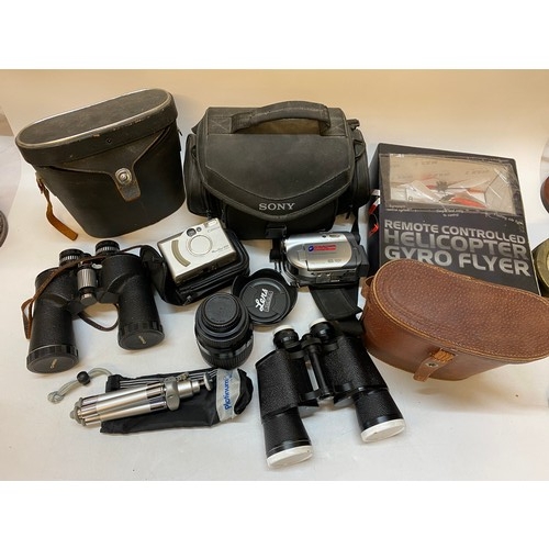 222 - A Sony camcorder, a Canon camera, two pairs of binoculars, remote control Helicopter Gyro Flyer, box... 