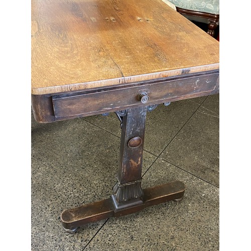 81 - A 19th Century rosewood table with rectangular top, end drawer, on panelled end supports with leaf f... 