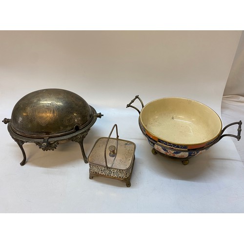 157 - A silver plated revolving breakfast dish, a butter dish with clear glass liner in a pierced silver p... 