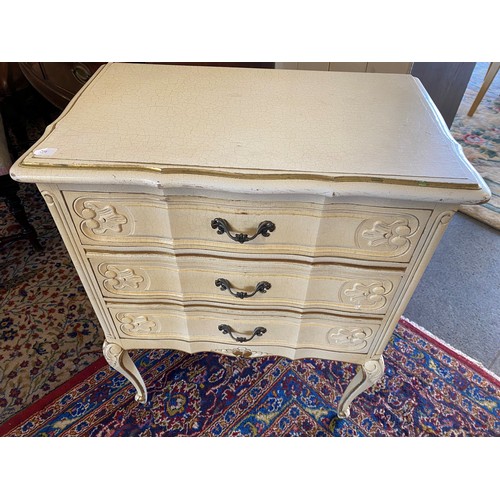 59 - A mahogany two tier tea trolley and a white painted chest fitted three drawers, on leaf carved cabri... 