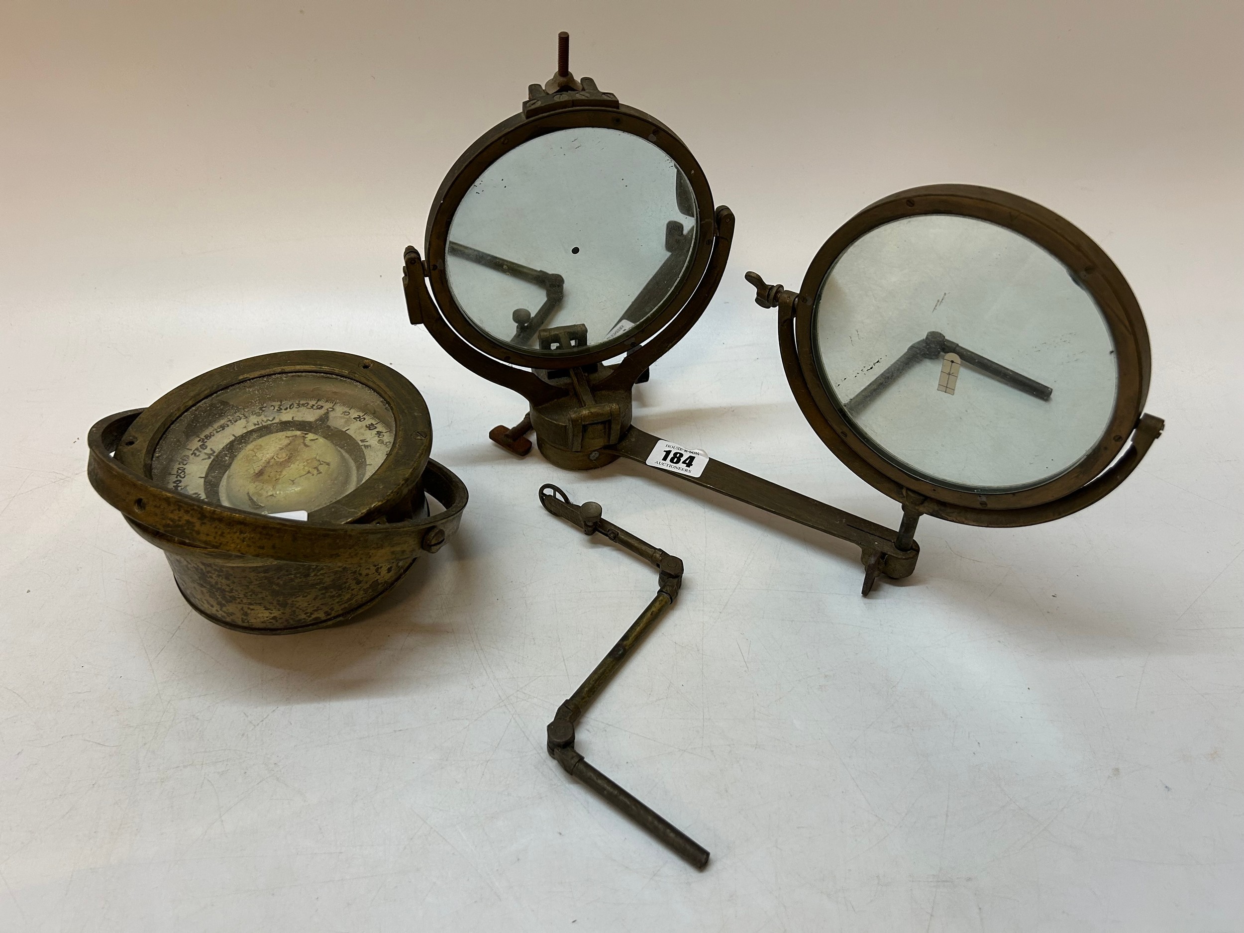 A brass framed Helio Morse Code signalling mirror and a brass framed ...