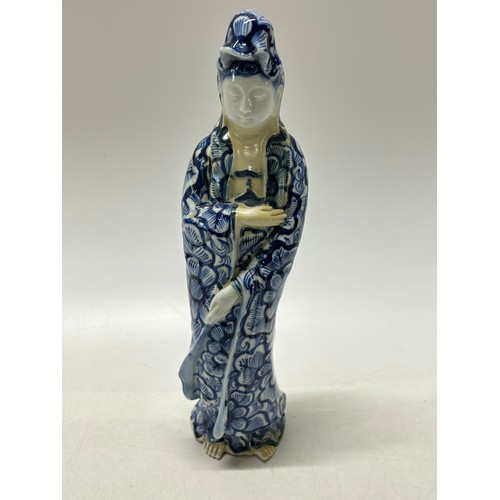 101 - A Japanese blue and white pottery model of Quan Yin - 14in. high