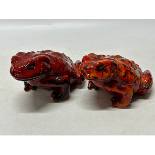92 - Two Anita Harris Art Pottery red glazed models of toads