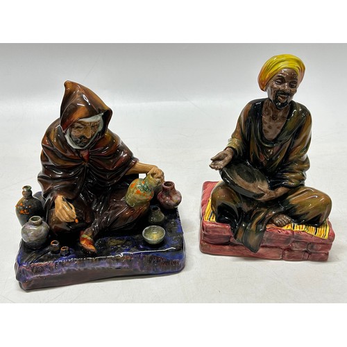 99 - Two Royal Doulton figures - The Potter HN1493 (af) and Mendicant HN1565