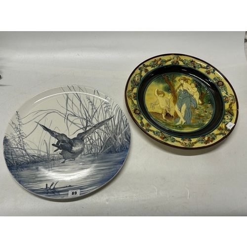 89 - A Victorian charger painted in blue with a duck by A.E. Austin 1880 - 15 1/2in. dia. and a majolica ... 