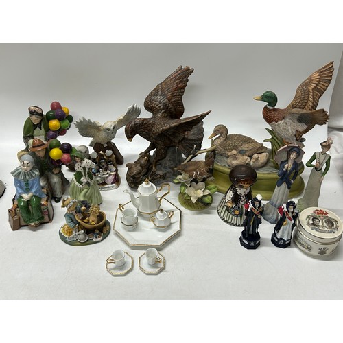 114 - A selection of decorative china including Royal Doulton style figures, mallard and drake, eagle, com... 