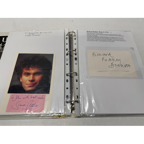20 - A folder of coloured and black and white photographs bearing signatures comprising:- Sir George Mart... 