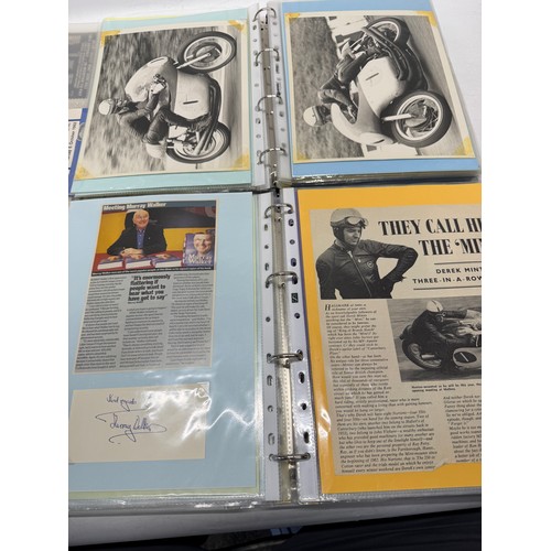 22 - A folder of coloured and black and white photographs bearing signatures comprising:- Geoff Duke, Mik... 